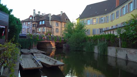 Empty-Wooden-Boats-Parked-Near-Water-Canal-in-La-Petite-Venise-in-Colmar