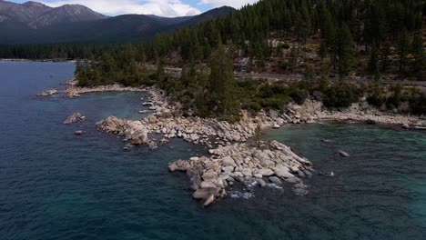 4k-Aerial-Drone-Footage-of-rocks-on-shoreline-in-Lake-Tahoe-Sierra-Nevada-mountains-in-Northern-California