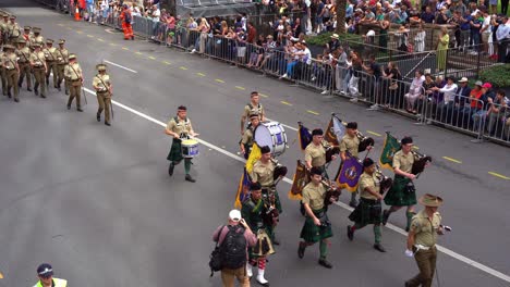 Disciplined-Australian-army-from-the-Australian-Defence-Force-uniformly-marching-down-Adelaide-Street,-Brisbane-city,-amidst-the-solemnity-of-the-Anzac-Day-commemoration