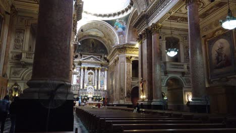 Inside-religious-catholic-church-San-Jose-Flores-Basilica-Eclectic-architecture-in-buenos-aires-argentina,-benches-and-golden-ornaments