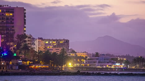 Sunrise-timelapse-of-coastal-city,-exotic-urban-area-of-Malaga,-Andalusia-wanderlust