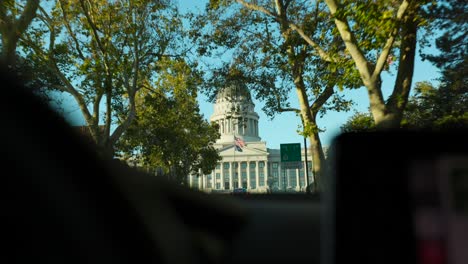 View-through-windshield-driving-towards-Utah-State-Capitol-building-entrance