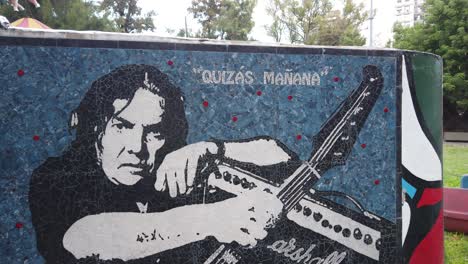 Artwork-of-Pappo-Norberto-Napolitano-argentine-musician-in-urban-plaza-Buenos-Aires-Landscape-in-Paternal-neighborhood-with-guitar-and-marshall-amplifier,-rockstar-of-south-america