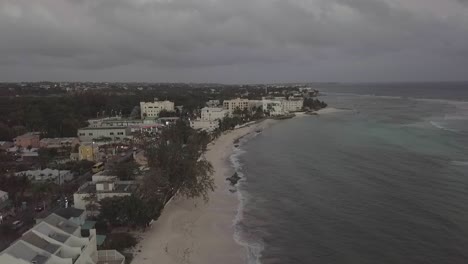 Flight-over-the-beach-and-hotels-in-Barbados-with-Mavic-Pro-at-the-evening,-birds-eye-view-of-the-beach-in-Barbados-in-Caribbean