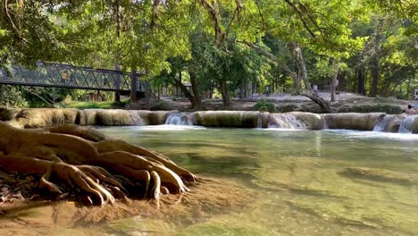 Stream-water-bed-in-jungle-and-iron-bridge,-Thailand