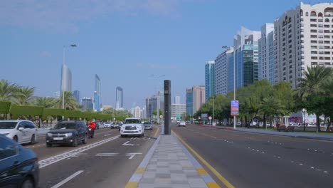 ABU-DHABI---January-2024:-Street-view-of-Corniche-Road-with-with-cityscpae-of-Abu-Dahbi,-United-Arab-Emirates