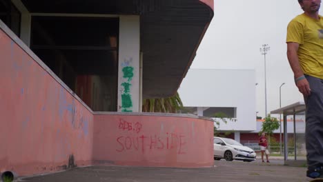 Skateboarder-kickflips-over-a-wall