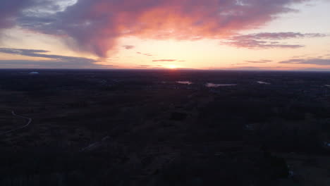 Blaine-wetland-sanctuary-in-Minnesota-during-dramatic-golden-sunset,-aerial