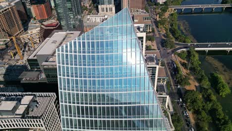 Top-down-view-of-glass-panels-of-the-Sailboat-building-reflect-the-sun-in-Austin