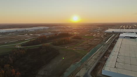 Aerial-reveal-of-Ford's-Megacampus,-BlueOval-City-in-Stanton,-TN-during-a-beautiful-sunset