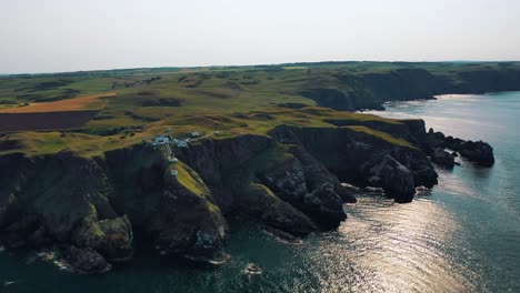 Aerial-Adventure-Over-Scottish-Cliffs:-The-Beauty-of-St-Abbs-Lighthouse,-Iconic-Scottish-Scenery,-Scotland