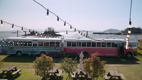 Colorful-buses-on-coast-in-Gunsan,-South-Korea,-part-of-Munyeodo-Bus-Cafe