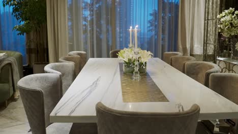 Elegant-White-10-seater-Quartz-Dining-Table-With-Candlelight-And-Flower-Centerpiece