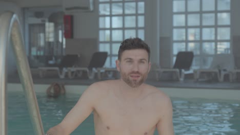 A-white-man-comes-out-of-the-indoor-spa-pool,-the-shot-is-in-slow-motion