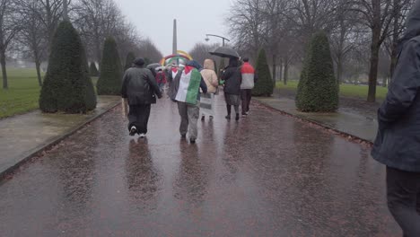 A-POV-of-walking-with-pro-Palestine-protesters-going-through-Glasgow-Green