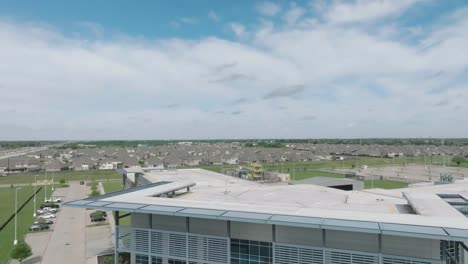 An-aerial-establishing-shot-of-the-LyondellBasell-Center-for-Petrochemical,-Energy,-and-Technology-building-at-San-Jacinto-College-in-Pasadena,-Texas