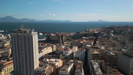 Cinematic-Aerial-View-Above-Castel-Nuovo,-Gulf-of-Naples-on-Scenic-Day-in-Napoli,-Italia