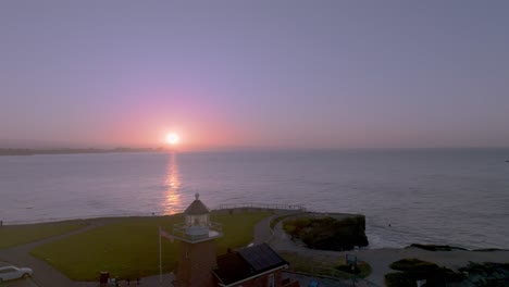 Unveil-the-enchanting-beauty-of-Santa-Cruz's-iconic-Steamer-Lane-Lighthouse-at-the-break-of-dawn-in-this-mesmerizing-aerial-footage