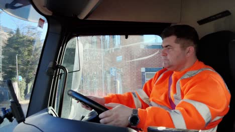 Lorry-Driver-Navigates-in-Bright-Daylight-Wearing-Reflective-Gear