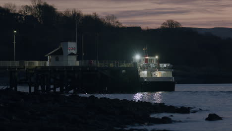 Ferry-boat-waiting-at-pier-in-morning-sunrise-light,-static-shot