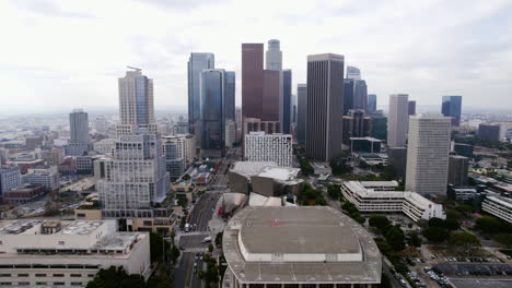 Downtown-Los-Angeles-Cityscape-Skyline,-Drone-Shot-of-Skyscrapers-in-Financial-District-and-Culture-Venues-on-Misty-Day