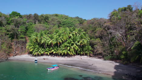 Slow-establishing-shot-of-small-boats-anchored-at-a-beach-in-Cebaco-Island