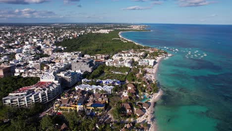Drone-Aerial-View-of-Playa-Del-Carmen,-Mexico,-Caribbean-Sea-and-Beachfront-Buildings
