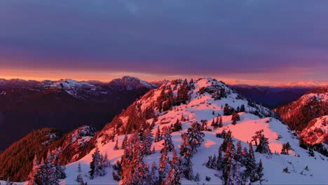 Snowy-Mountain-Peaks,-Dramatic,-Colorful-Sunset-Sky