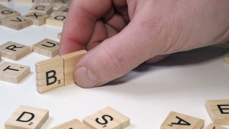 TRUMP-name-in-Scrabble-letter-tiles-fall,-replaced-with-word-BIDEN