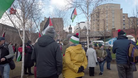 A-woman-wearing-a-knitted-Palestine-colour-beanie