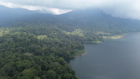 Aerial-drone-view-of-the-Danau-Buyan-Lake-in-Bali,-Indonesia-and-surrounding-forests-and-jungle