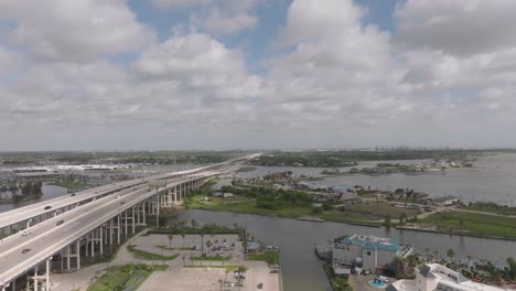 An-aerial-view-of-the-Kemah-Bridge,-with-the-recently-opened-new-spans-and-lanes-in-Kemah-and-Seabrook,-Texas