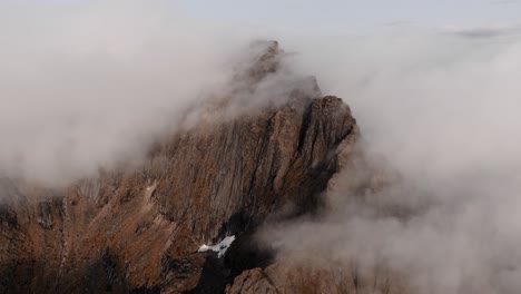 Aerial-view-of-Segla-mountain-above-the-sky,-Norway-during-summer