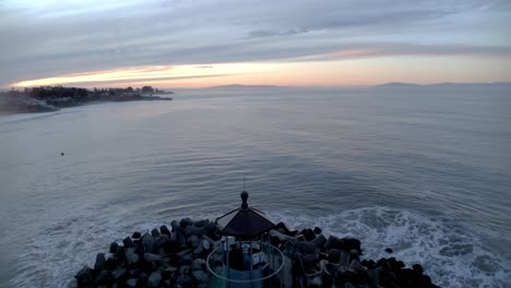 Beautiful-video-of-lighthouse-symmetrically-lined-up-in-the-center-of-the-frame-just-before-sunrise