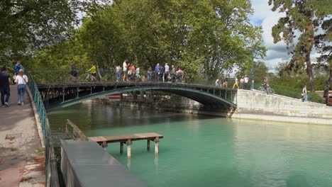 People-Enjoy-Their-Day-on-Puente-de-los-Amores-near-Annecy-lake