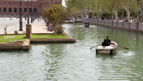 Plaza-De-Espana-River-Boat-Ride-In-The-Parque-De-María-Luisa-In-Seville,-Spain