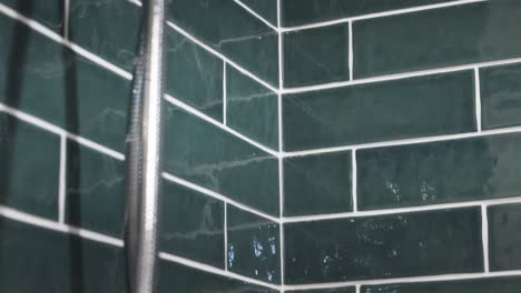 Tilting-to-a-modern-showerhead-in-a-luxury-bathroom