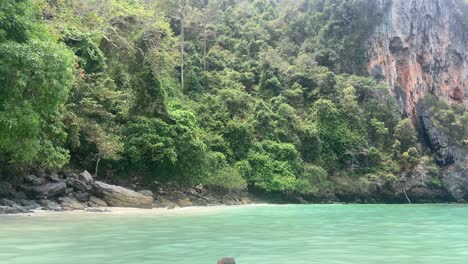 Old-man-happily-swimming-in-the-turquoise-waters-of-Phi-Phi-islands