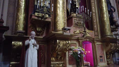 Statue-of-altar-and-Pope-John-Paul-II-inside-Basilica-of-Buenos-Aires-Argentina-San-josé-de-Flores,-golden-eclectic-architecture-and-sculptures-of-christian-deities