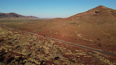 A-road-train-passes-through-Aboriginal-land-near-Mount-Bruce-in-Western-Australia