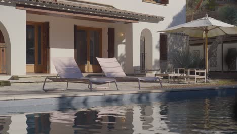 Poolside-loungers-at-a-villa-retreat
