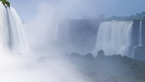 Timelapse-of-a-big-Waterfalls-of-Iguazu-around-a-big-green-area-and-a-river,-in-a-sunny-day,-Foz-do-Iguacu,-Parana,-Brazil