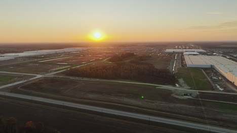 Aerial-wide-pan-of-Ford's-massive-BlueOval-City-at-Sunset-in-Stanton,-TN