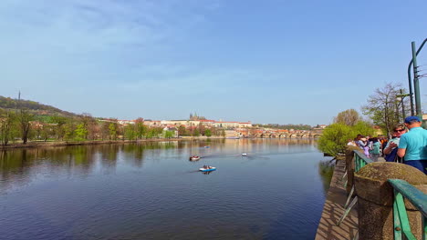 Tourists-Sightseeing-Near-Vltava-River-In-Prague,-Czech-Republic