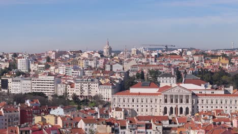 Aerial-pan-across-Lisbon-Portugal-government-buildings-with-red-roofs-and-white-rock-walls