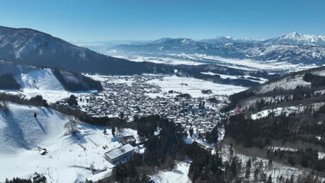 Aerial-orbiting-shot-of-Japans-Nozawaonsen-Mountain-Ski-Resort-Village