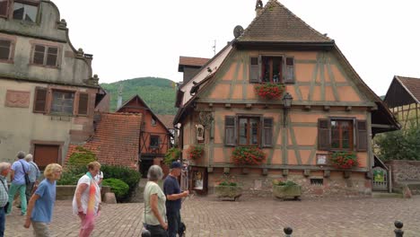 Tourists-Pass-Half-Timbered-Houses-in-Kayserberg-Village