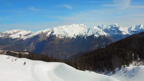 Snow-capped-Mountain-Range-From-Chairlift-In-French-Alps