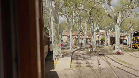 Scenic-view-from-a-train-of-Soller,-Mallorca-with-quaint-town-backdrop