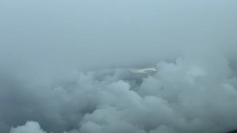 Immersive-pilot-POV-flying-across-a-stormy-sky-as-seen-by-the-pilots-of-a-jet